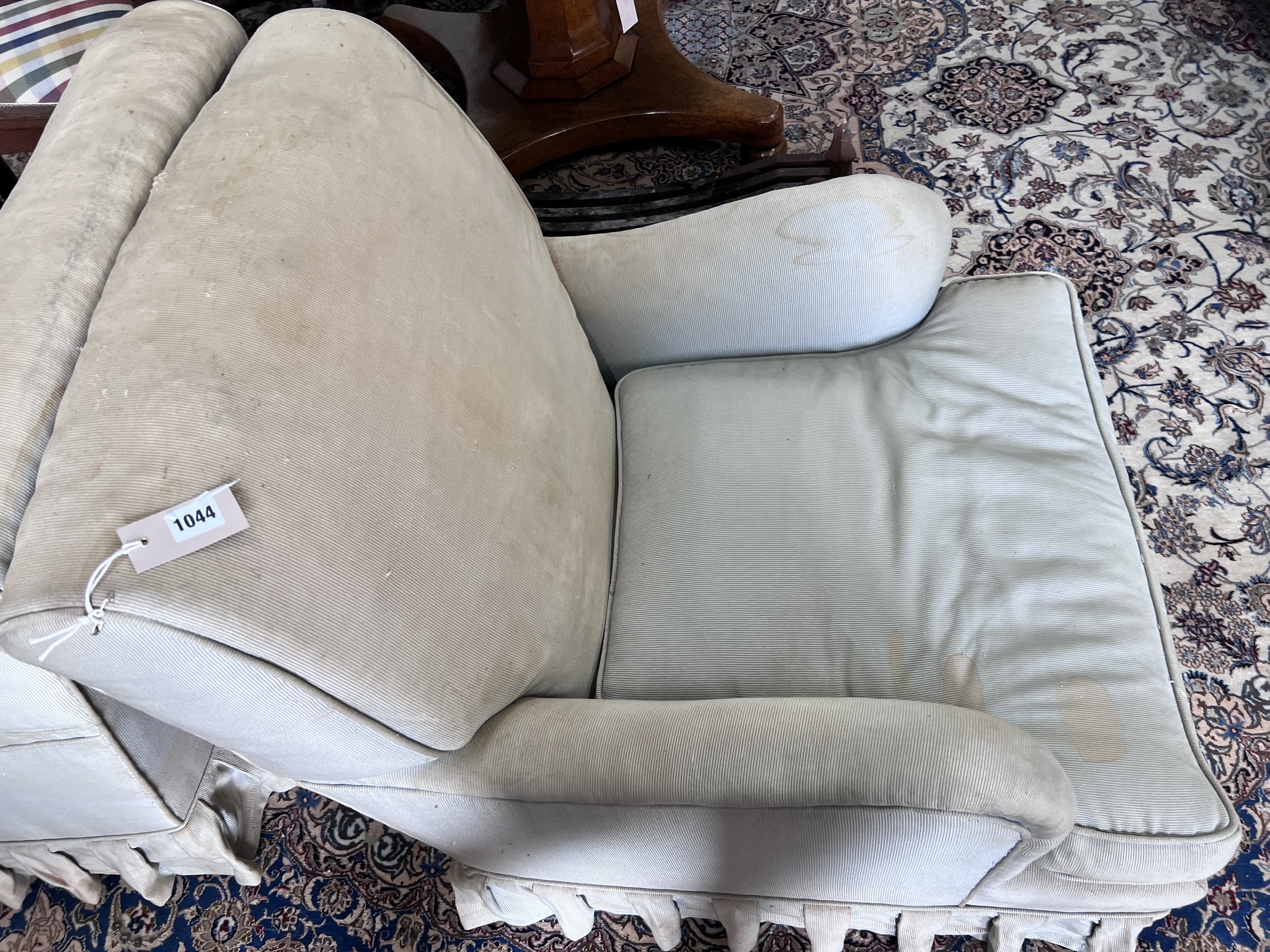 A pair of Howard style upholstered armchairs, width 69cm, depth 88cm, height 82cm